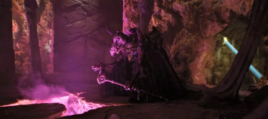 Purple robed Skeksis opens hand in an apparent ritual